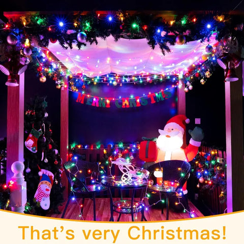 Decorated Christmas gazebo with colorful lights, Santa Claus figure, and festive decorations.